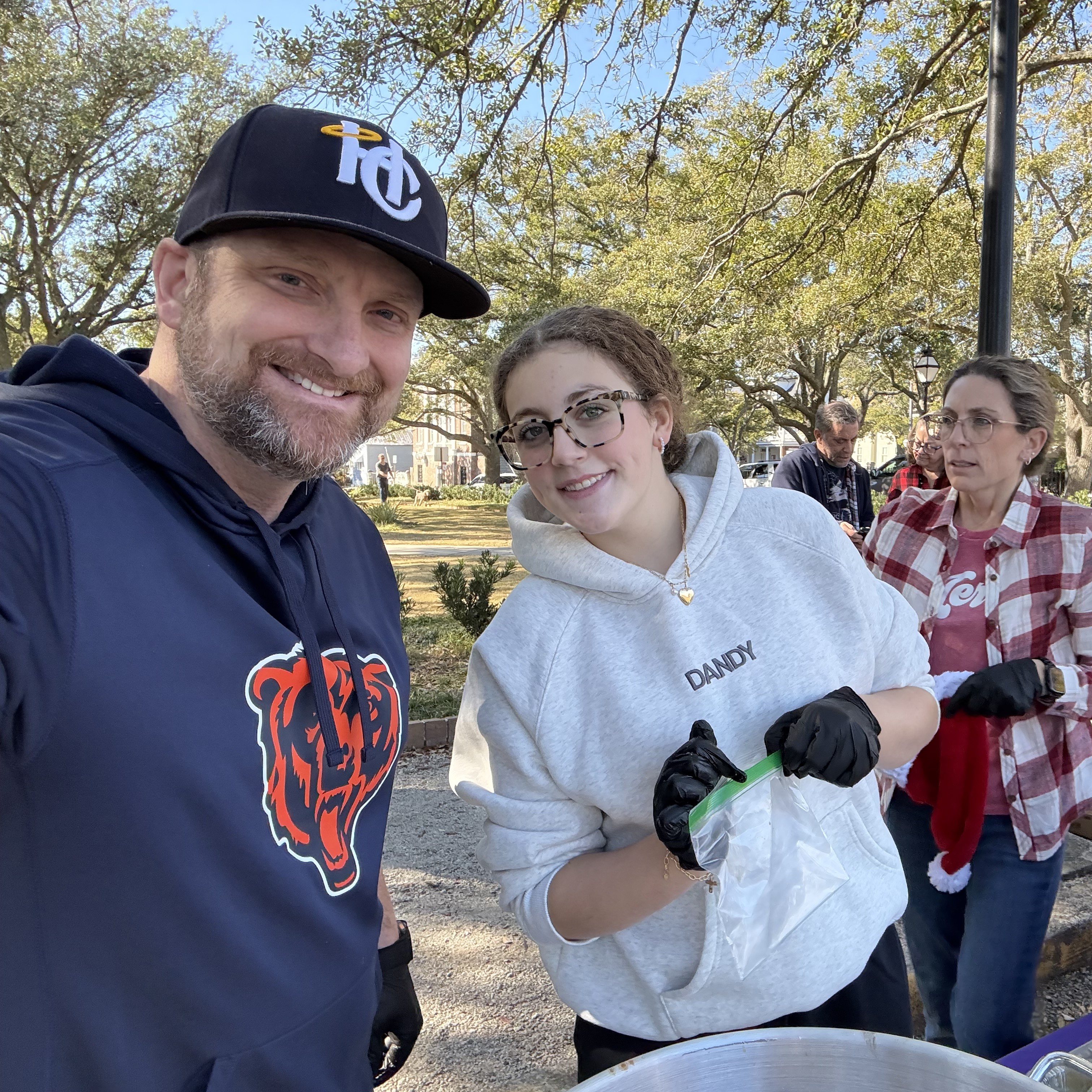 Dr. Olendorf and his daughter Emma volunteering at Potluck in the Park