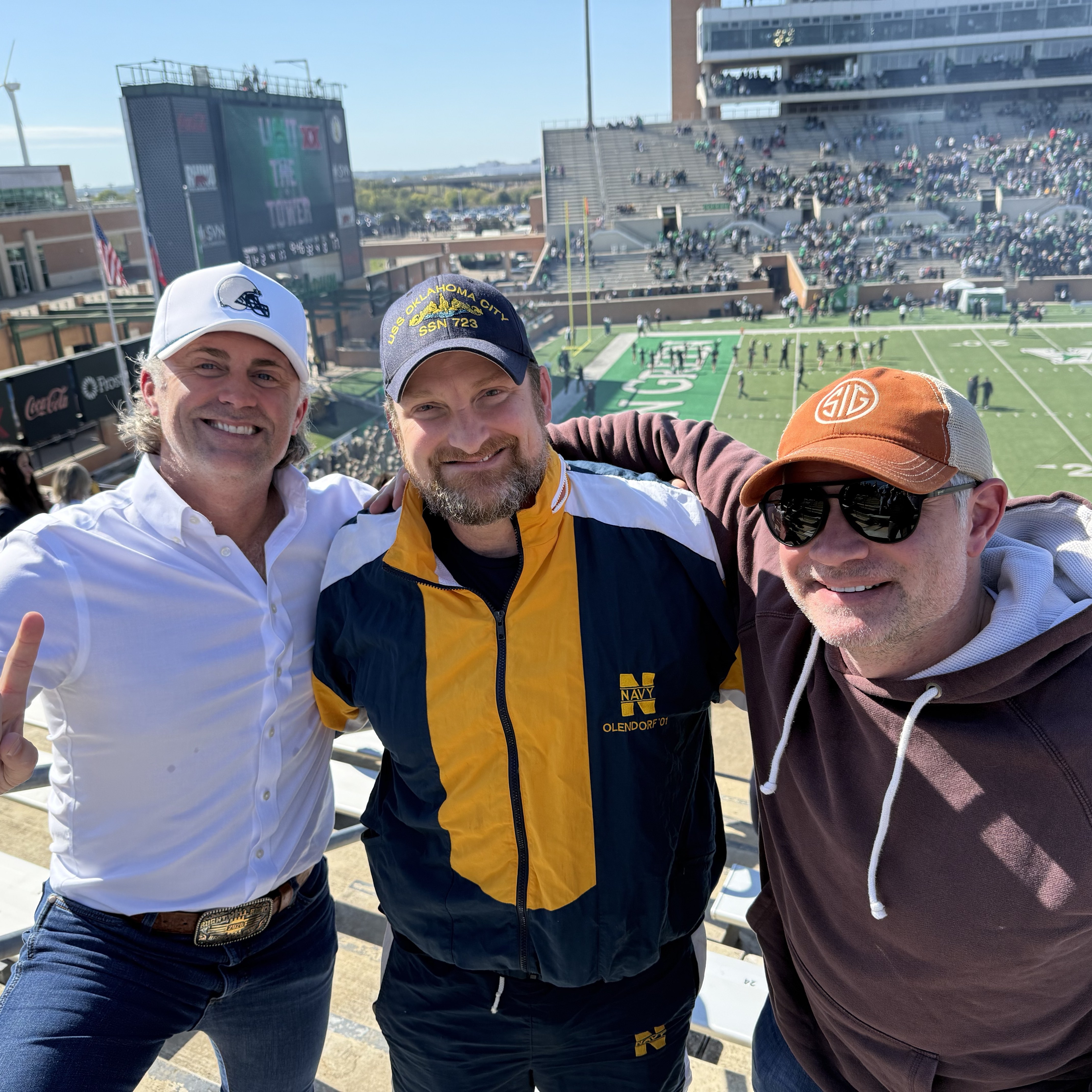 Dr. Olendorf with friends at a Navy football game