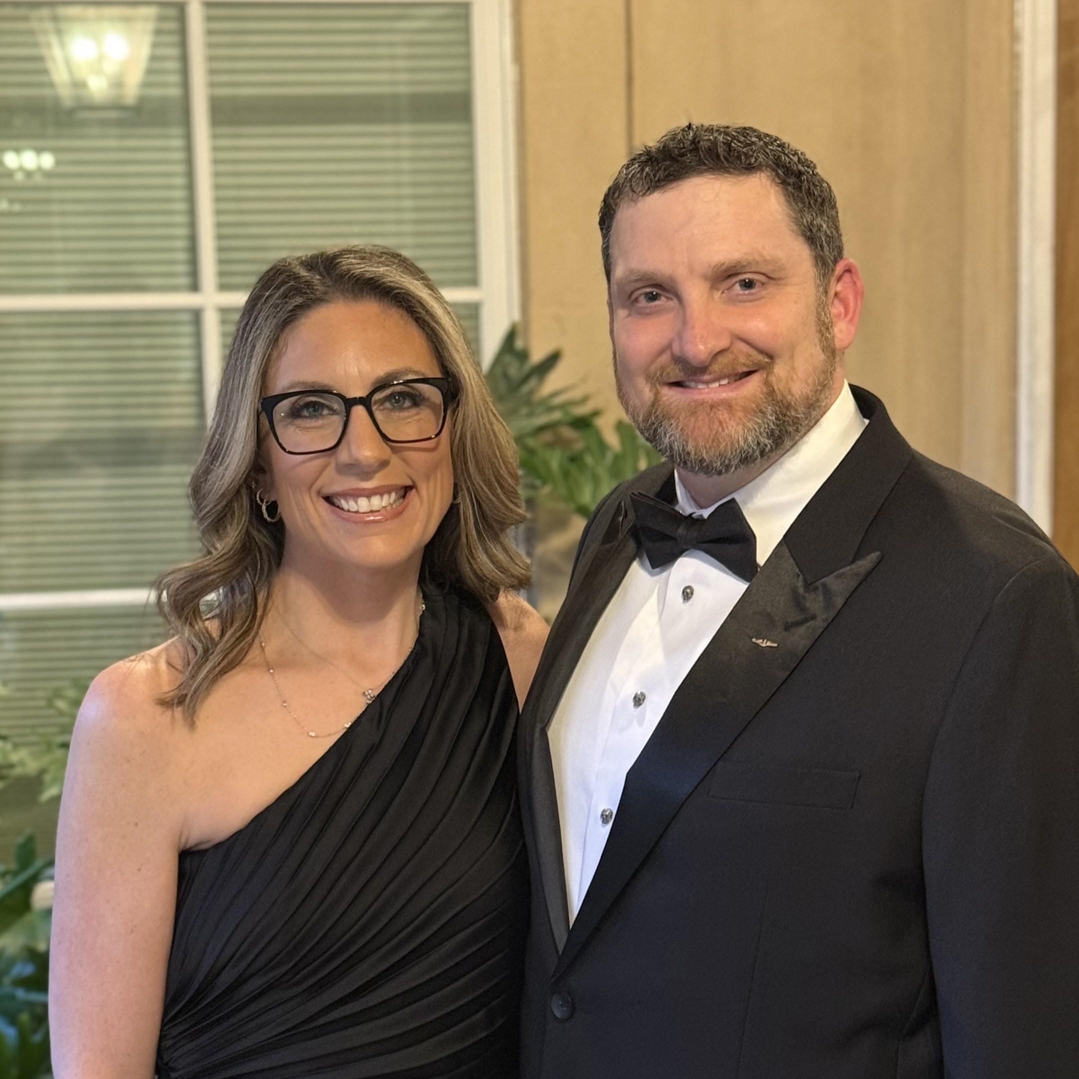 Dr. Olendorf and his wife at a formal event